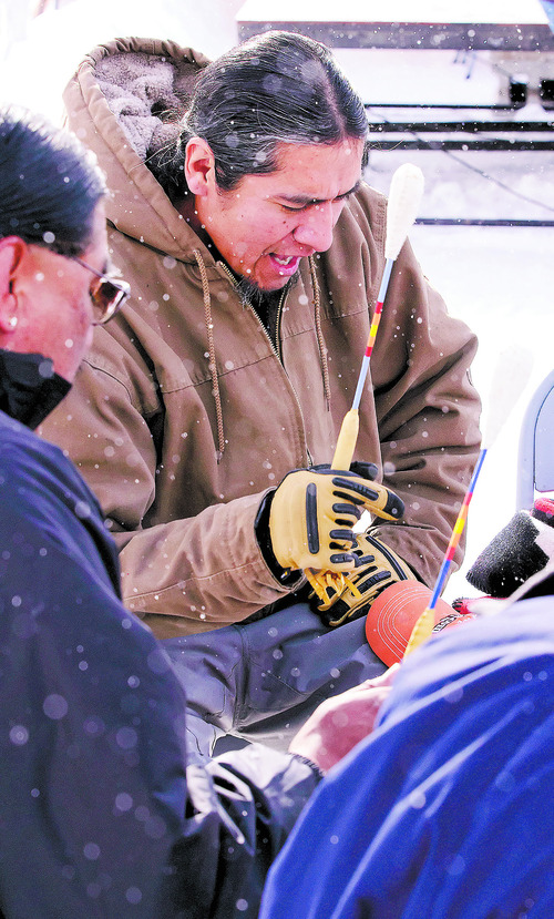 Garth Bear, left, and Lance Tissidimit sing an honor song during the 150th anniversary memorial ceremony of the Bear River Massacre, Tuesday, Jan. 29, 2013 near Preston, Idaho. (Eli Lucero/Herald Journal)